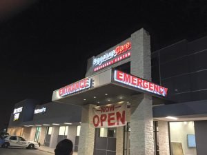 channel letters banner outdoor storefront building illuminated backlit sign 300x225 Sign Shop